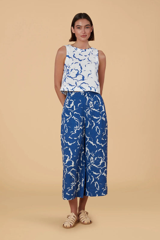 white top with blue abstract shapes