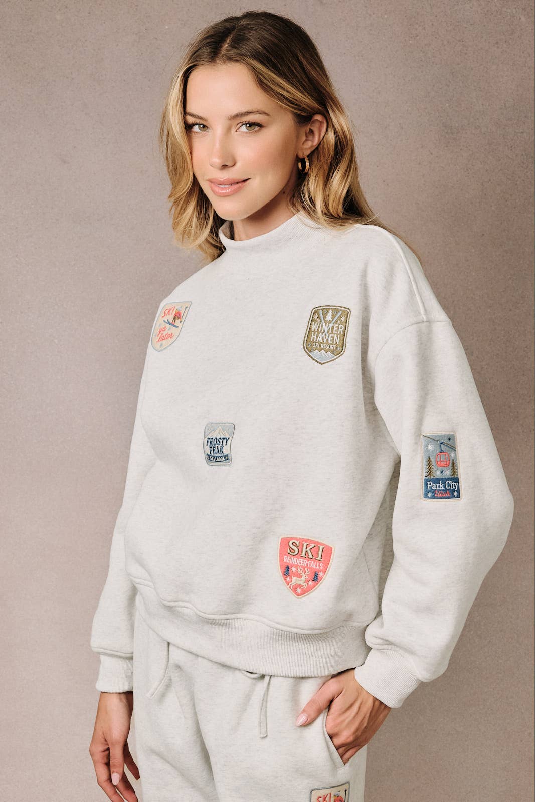 HIGH NECK LONG SLEEVE "SKI PATCHES" SWEATSHIRT