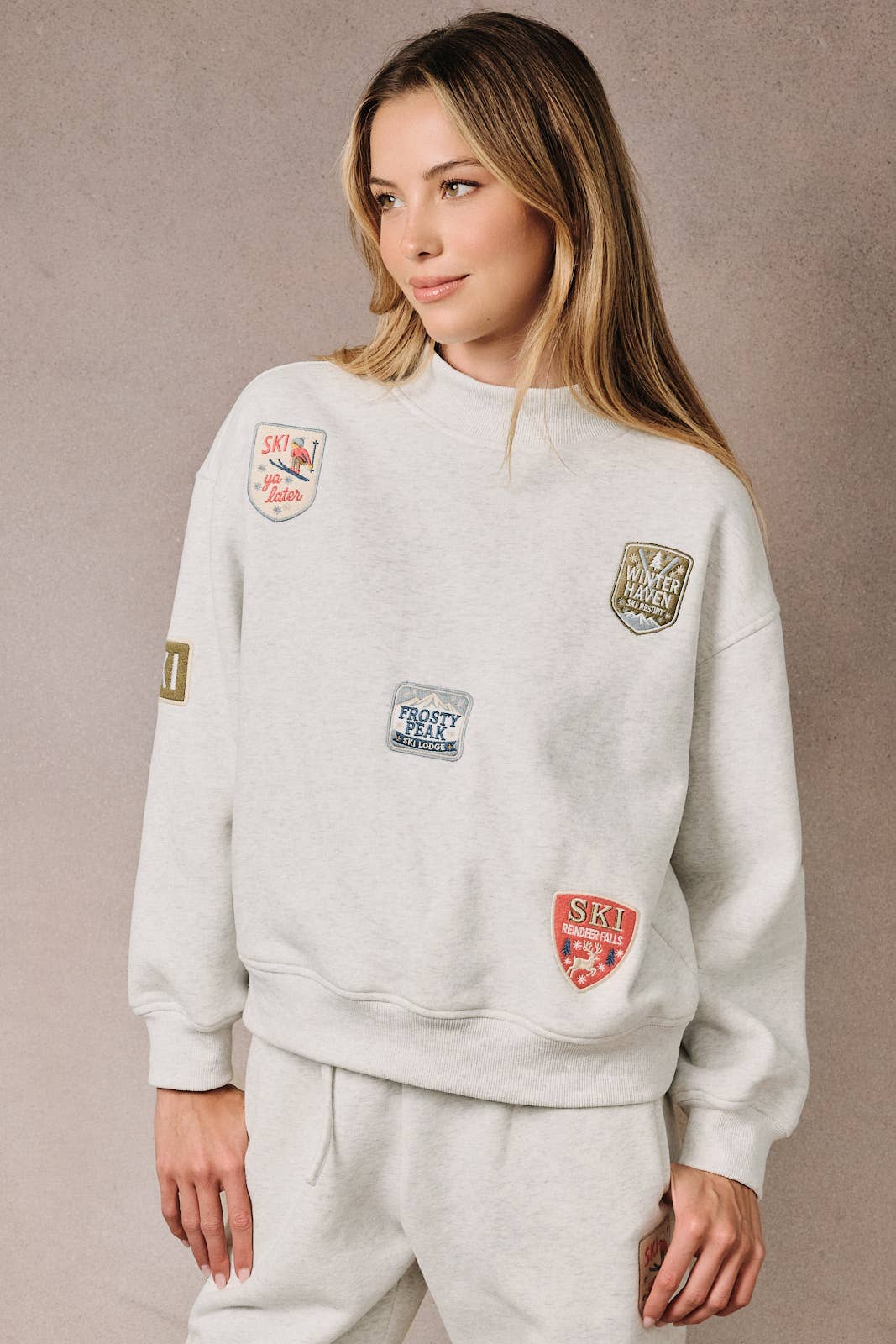 HIGH NECK LONG SLEEVE "SKI PATCHES" SWEATSHIRT
