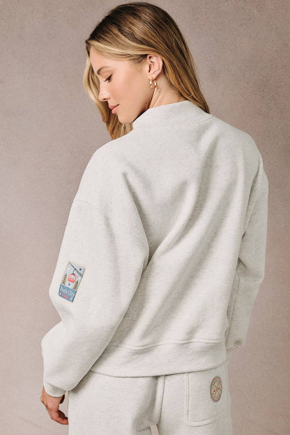 HIGH NECK LONG SLEEVE "SKI PATCHES" SWEATSHIRT
