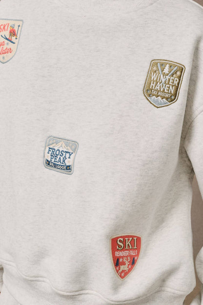 HIGH NECK LONG SLEEVE "SKI PATCHES" SWEATSHIRT